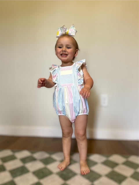The Pastel Rainbow Ruffle Romper